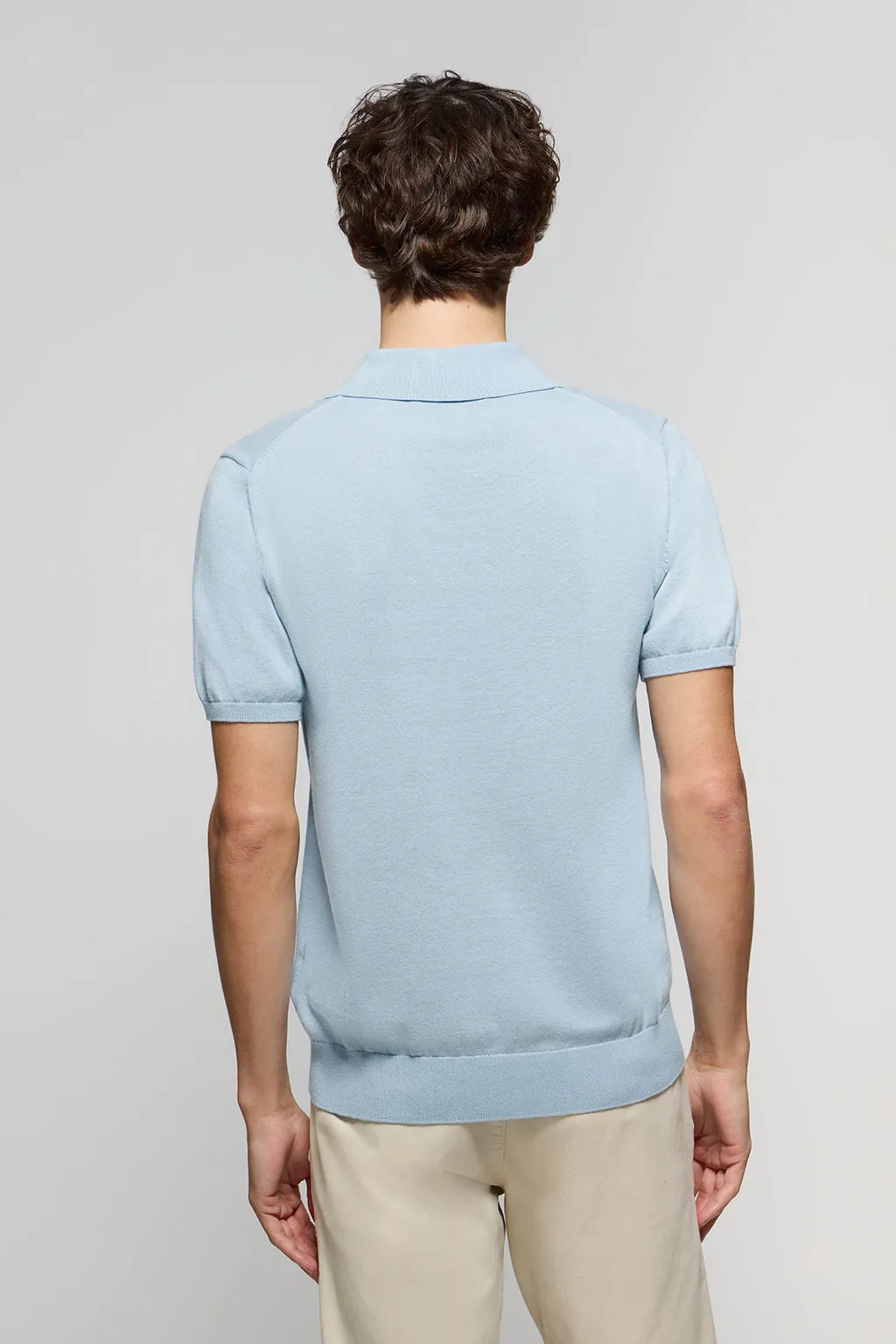 Polo de punto azul celeste con bordado Rigby Go